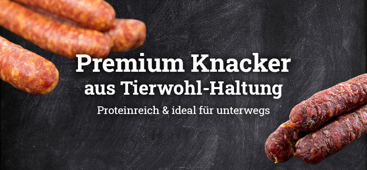 Bierknacker und Rindsknacker mit dem Text Premium Knacker aus Tierwohl-Haltung. Proteinreich und ideal für unterwegs